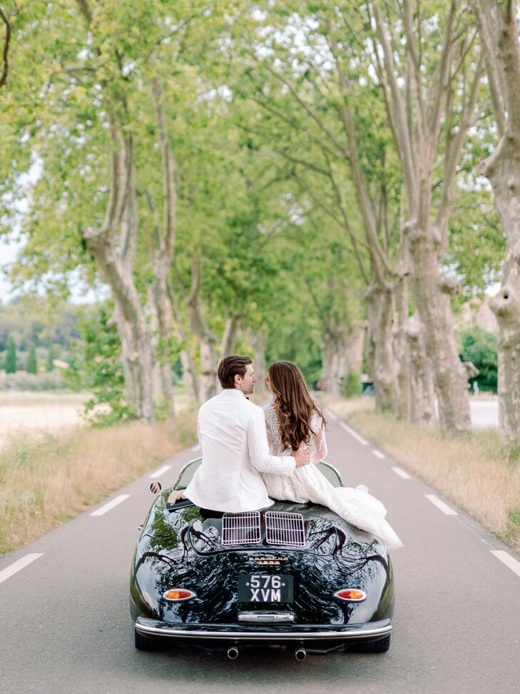 Bride and Groom in White Attire in Small European Getaway Car in South of France