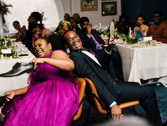 Wedding shoe game being played by newlyweds at a reception
