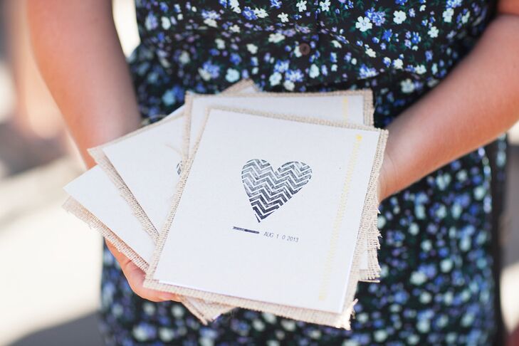 The chevron heart motif adorning the front of Danielle and David’s ceremony programs had a fingerprint-inspired look, a fitting choice for the couple’s ultra-personalized celebration.