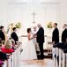 Amy and Paul directly incorporated their family into the traditional ceremony. Amy's sons served as bridesmen and walked her down the aisle, while Paul's three sons waited by the altar as his groomsmen. Each man wore a classic black tuxedo from Men's Wearhouse with a white shirt and silver tie. Paul stood out in a custom tuxedo by John Craig and white anemone boutonniere.