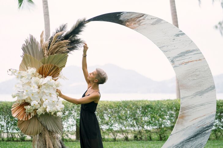 Event Planner Decorating Wedding Arch at Rosewood Phuket in Thailand