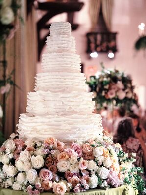 Large Six-Tier Wedding Cake With Ruffle Decorations
