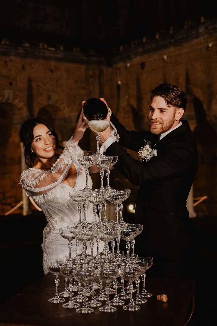 Newlyweds Pour Prosecco on Glass Tower at Destination Wedding in Italy