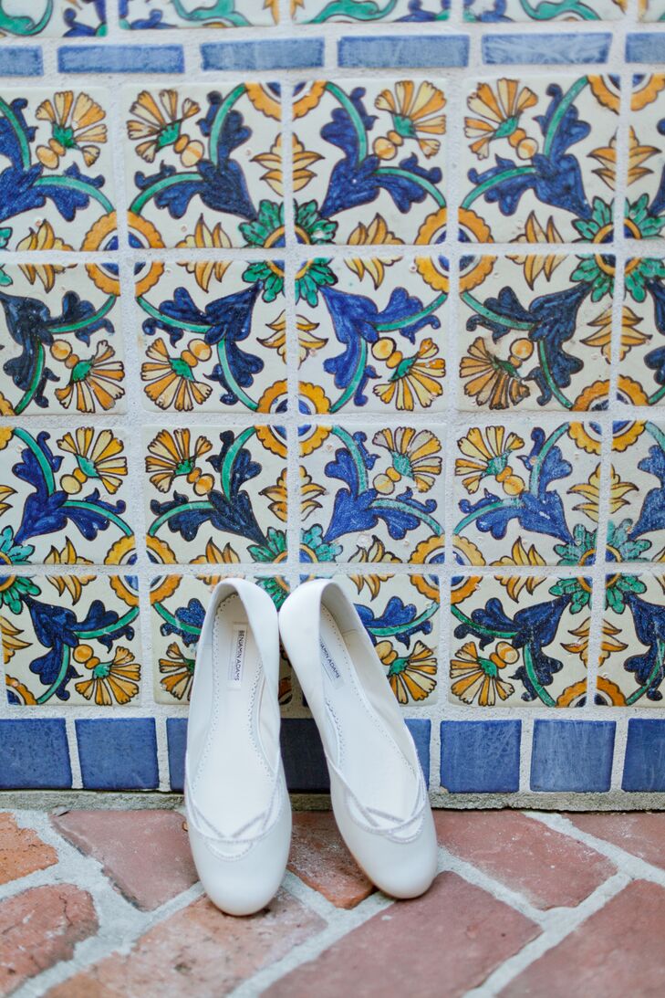 “The best thing I did was wear flat ballerina wedding shoes," says Marie. "I was so comfortable and danced the night away pain free!” She wore a pair of simple white "Renee" shoes by Benjamin Adams London with a silver, cutout detailing along the front.