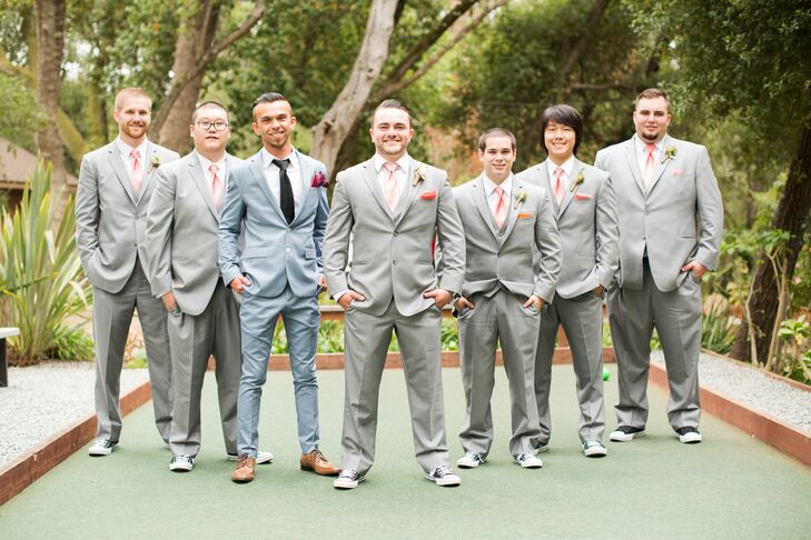 Nicholas and his groomsmen brightened their light gray suits with vibrant peach pocket squares and ties. To add a level of casualness, each also sported Chuck Taylor Converse sneakers.