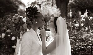 LGBTQIA+ Couple Smiling and Embracing