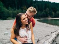 Young couple laughing on beach