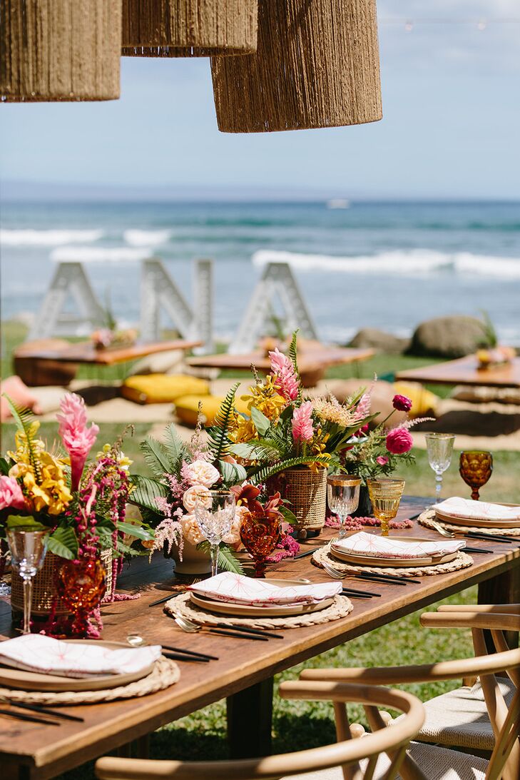 Long Table, Chandeliers Overheard With Colorful Flowers on Hawaii Beach