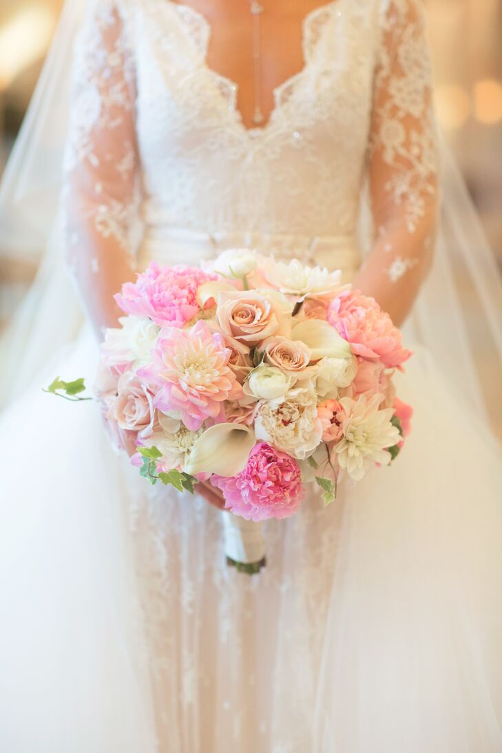 “I didn’t want your typical rose bouquet,” Shayna says. “I wanted it to be big and fluffy.” She carried a loose round bouquet with pink peonies, white miniature calla lilies, white sweet peas, pink dahlias, pink ranunculus and champagne roses accented with ivy and wrapped in an ivory satin ribbon.