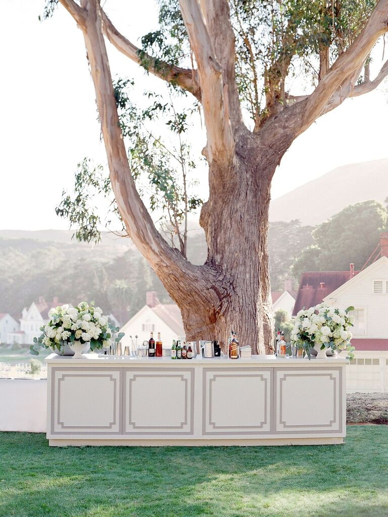 White paneled bar top for outdoor wedding reception