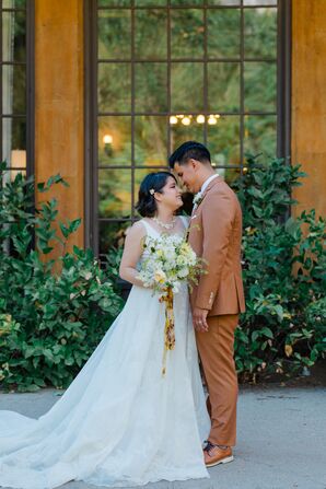 Bride in A-Line Gown, Natural Wildflower Bouquet and Groom in Burnt Orange Suit