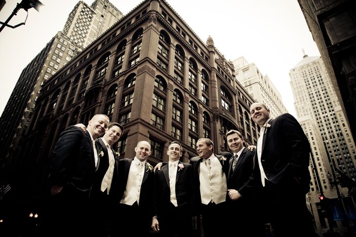 The groomsmen wore Calvin Klein tuxedos as they posed for a quick photo op in downtown Chicago.
