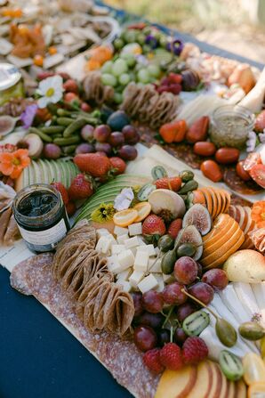 Appetizer Board With Meats, Fruits, Veggies and Dip Accented With Flowers