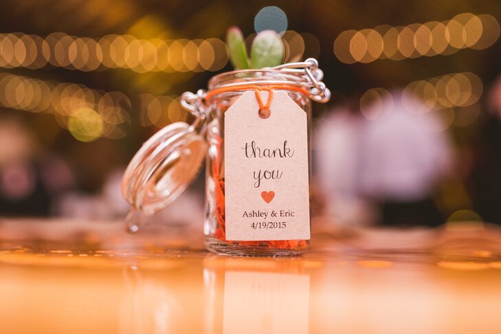 Ashley and Eric put their own spin on a rustic wedding favor. Each guest took home a different mini succulent planted in a wine cork and set inside a mini mason jar.