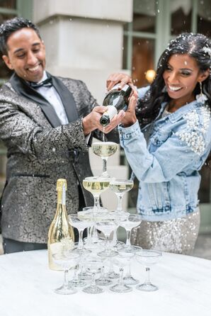 Couple Pouring Champagne Over Champagne Tower for Elopement at the Anderson House in Washington, DC