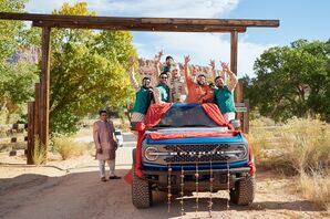 Indian Groom and Groomsmen in Traditional Attire on Bronco Jeep in Red Rock, Zion