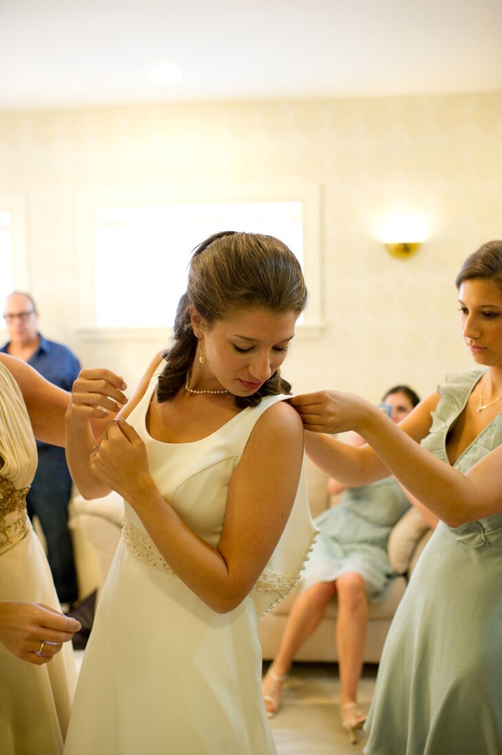 "I wore a custom-made dress by Callie Tein, of Modern Trousseau," Sarah says. "I designed the dress based on my maternal grandmother's wedding dress. It has a clean, timeless look."