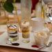 Sarah and Michael served kosher food options at their wedding reception, including a delicious assortment of dessert options, including whimsical layered cakes in clear glasses.