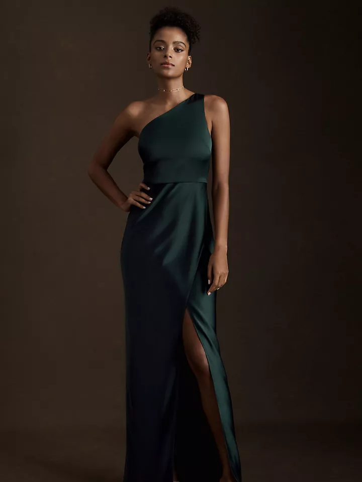 A model wears this emerald one-shoulder floor-length evening gown.