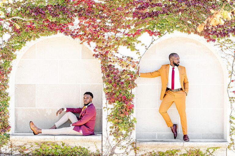 Engagement photo with vine-covered wall backdrop