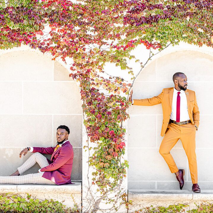 Engagement photo with vine-covered wall backdrop