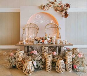 Boho Sweetheart Table with Woven Lanterns and Wicker Chairs