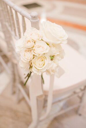 Aisle Decorations of White Roses and Ribbon on Chiavari Chairs