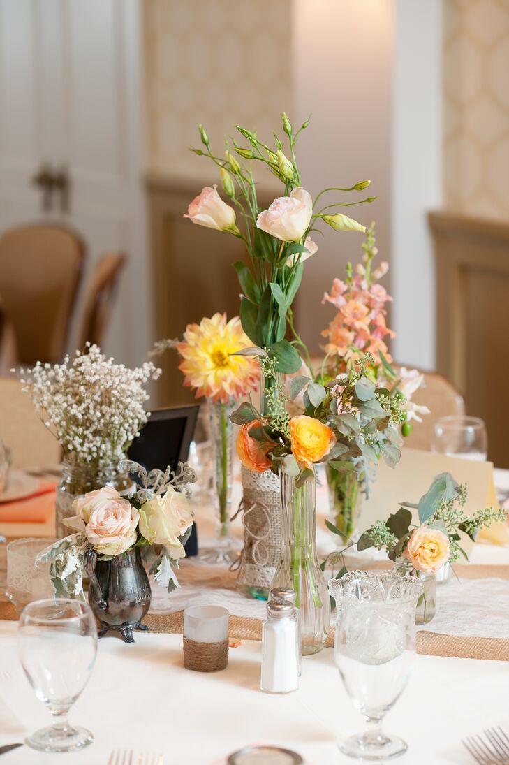 Lori collected various glasses and vases throughout the wedding planning for the centerpieces.