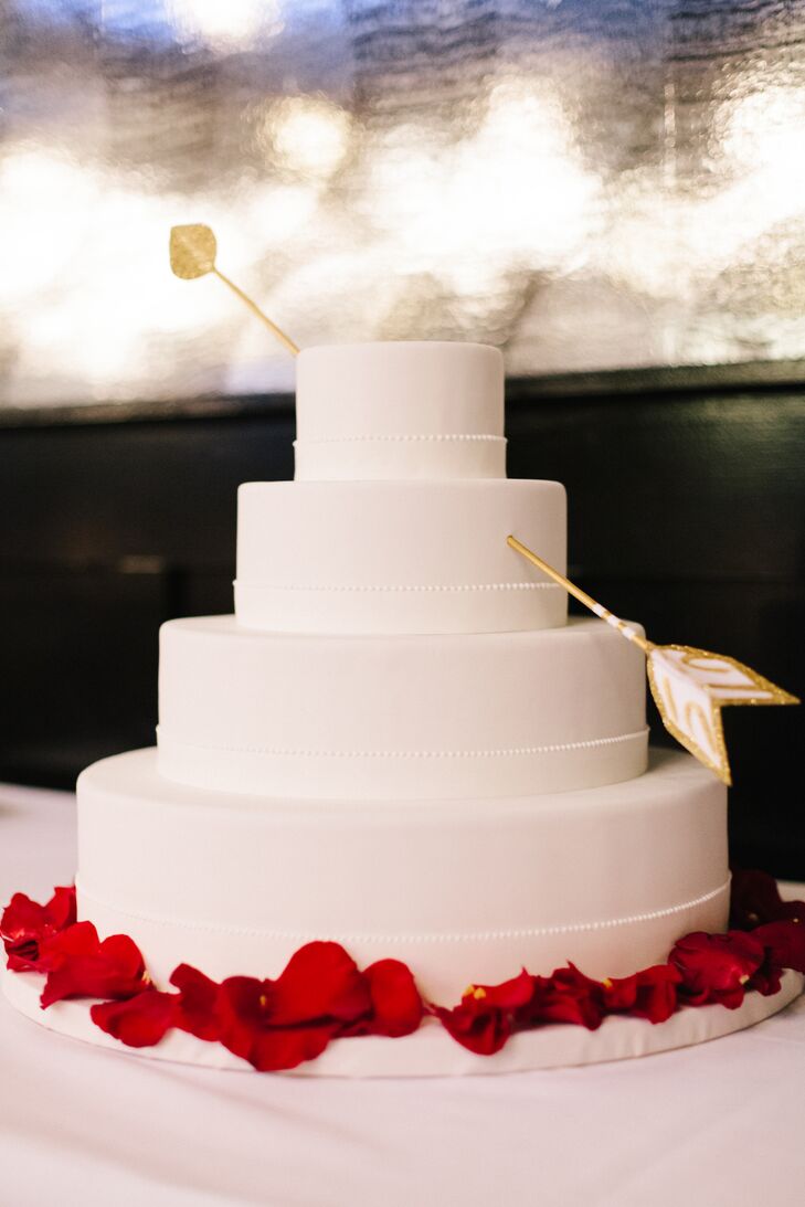 Dessert included a red velvet wedding cake by Betty Bakery and Mexican hot chocolate ice cream provided by Ample Hills Ice Cream. "Instead of a traditional topper, we found a two-piece arrow from an Easy shop, Icing101, that looked like it had been shot through the cake," Allison says.