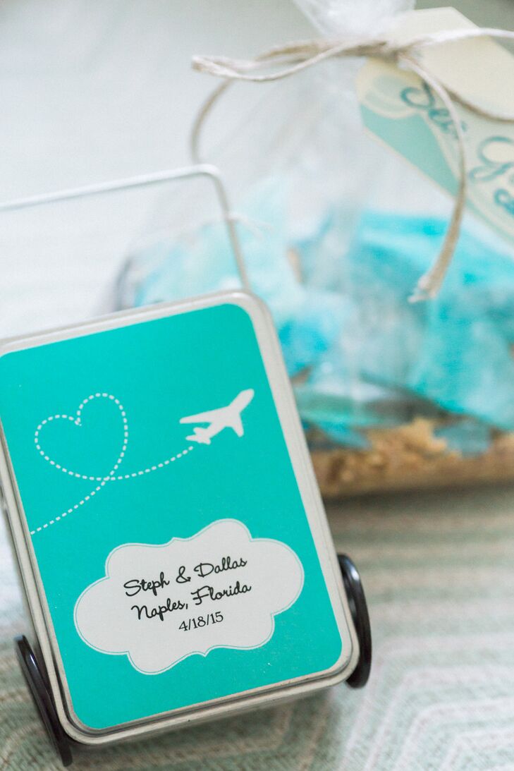 Instead of giving out favors at the wedding, Stephanie and Dallas gave their guests large welcome bags before the celebration. Each one reflected their professions at Southwest Airlines with suitcase-inspired tins of mints and peanuts. Their beach theme was also incorporated with blue sea glass candy.