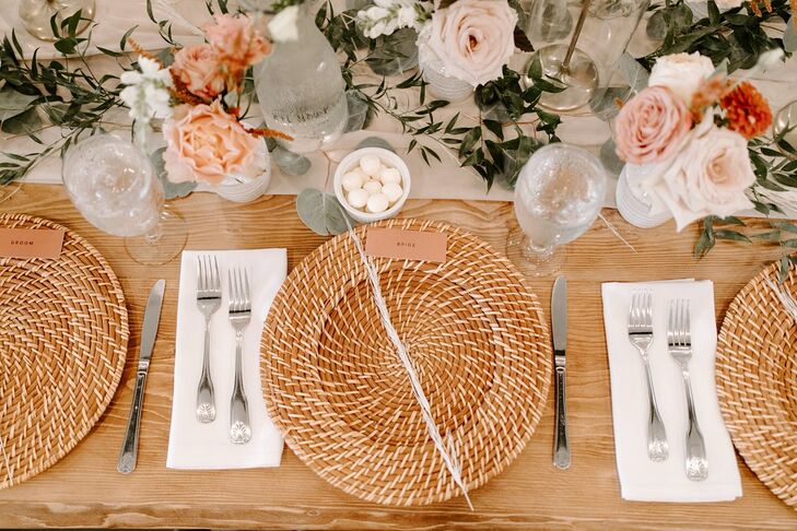 Bohemian Centerpieces with Woven Chargers and Rose Centerpieces