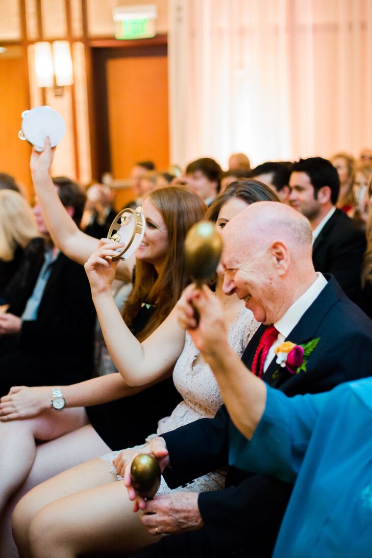 Before they were pronounced husband and wife, the pastor asked guests to look under their seats where Kelly and Adam had placed tambourines and maracas for them to play in celebration as they sealed the deal with a kiss.