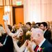 Before they were pronounced husband and wife, the pastor asked guests to look under their seats where Kelly and Adam had placed tambourines and maracas for them to play in celebration as they sealed the deal with a kiss.