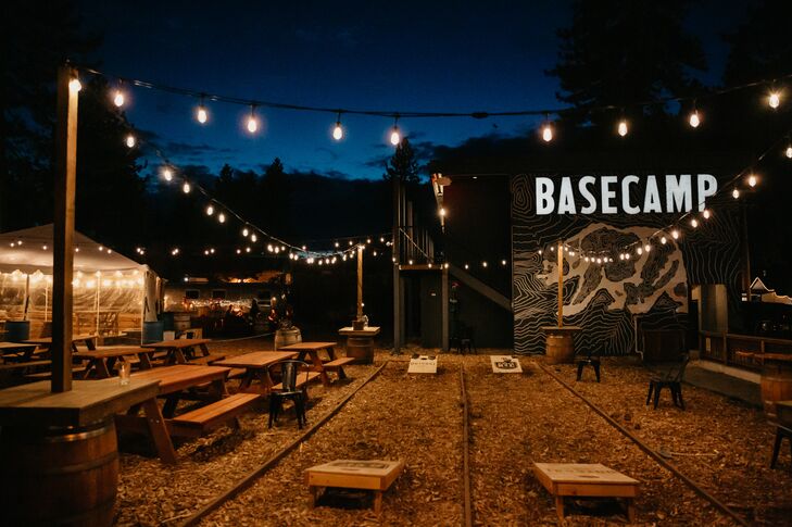 Casual Reception with Picnic Tables, String Lights and Cornhole