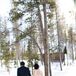 Kristen wore a champagne Marisa wedding dress with a white lace overlay and keyhole back for her January wedding. For the ceremony, she also wore a white fur cape to keep warm in front of the open barn doors.
