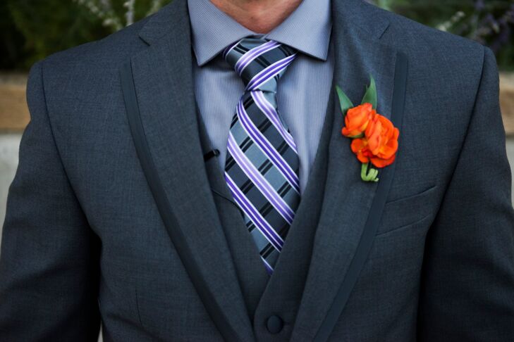 The groom and groomsmen wore three-piece gray suits with gray and purple patterned ties. They completed the look with orange rose bloom boutonnieres.
