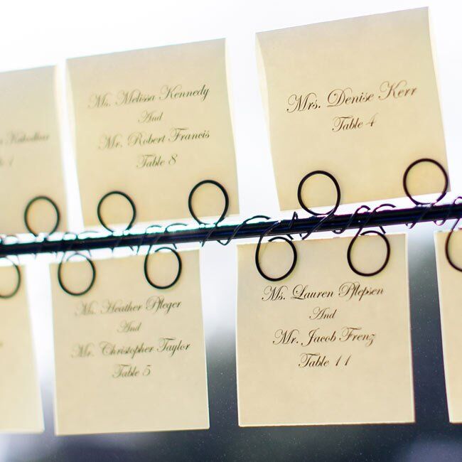 Formal black and white escort cards informed guests of their table numbers.