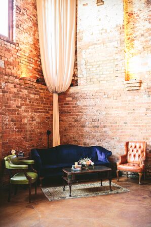 Vintage Lounge Furniture Among Brick Walls and Draping