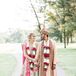 For their second Hindu ceremony, Arselie and Vikas wore traditional clothing. "My lehenga consisted of an embroidered gold top was a greenish blue with pink flower accents and a matching scarf," says Arselie. "I was decorated head to toe in the most gorgeous traditional Indian jewelry, and I loved my headpiece so much I wore it the entire night!"