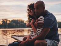 Couple embracing each other and smiling.