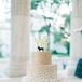 The wedding cake was flavored with strawberry cream and chocolate hazelnut. It was decorated in gold and featured a basset hound topper that represented Erin and John's pet dog.
