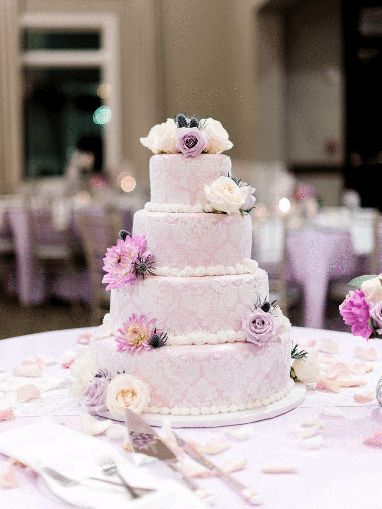 A purple Jordan almond-flavored wedding cake at a wedding ceremony.