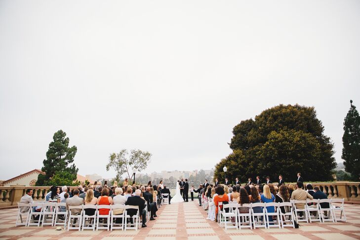 “The only thing needed at the ceremony were the chairs! No aisle runner, archway and flower decor. All natural beauty, simple and elegant,” says the couple.