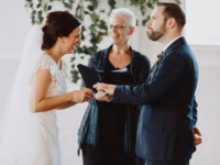 Bride and groom and officiant at wedding ceremony