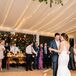 First Dance in Tented Reception Space Lined with Overhead Lighting
