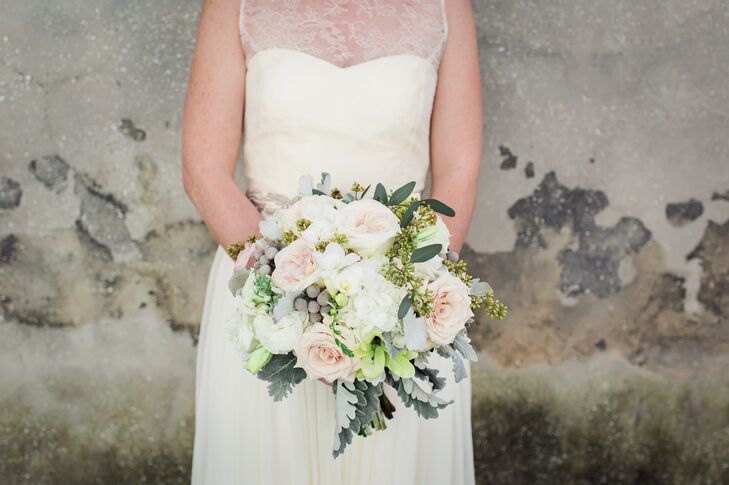 Alex complemented the couple's vintage decor with a bouquet of blush roses, white hydrangea, seeded eucalyptus, silver brunia and dusty miller.