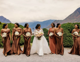 bride walks with bridesmaids in brown dresses at Lake Como