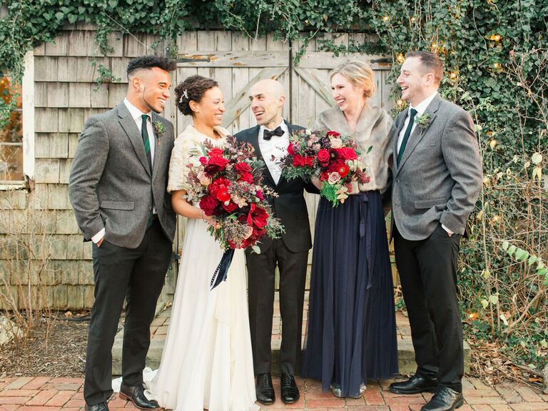 Bride and groom with wedding party at holiday wedding
