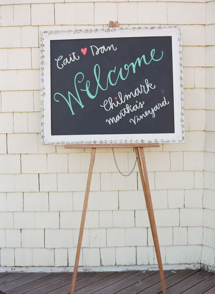 Kate Yenrick, a close friend of Caitlin, designed the chalkboard welcome sign at the entrance to the tent.