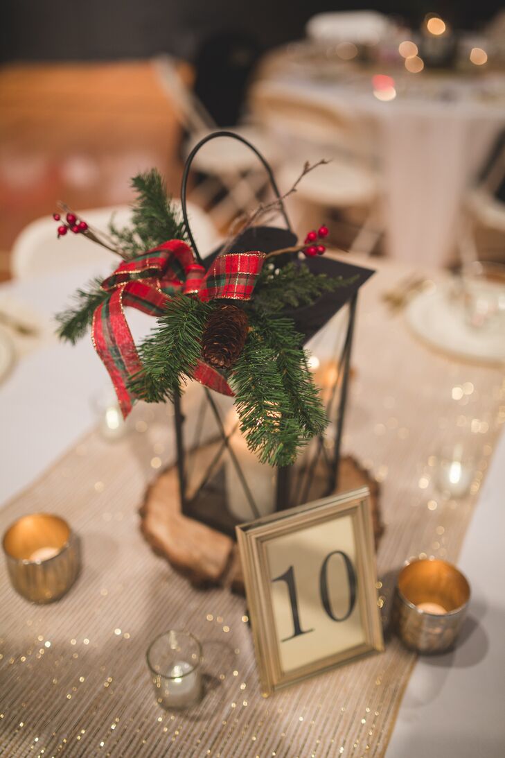 Small gold candles surrounded the black lantern centerpieces and gold-framed table numbers, creating a warm ambience to Elizabeth and Mason's wedding reception.